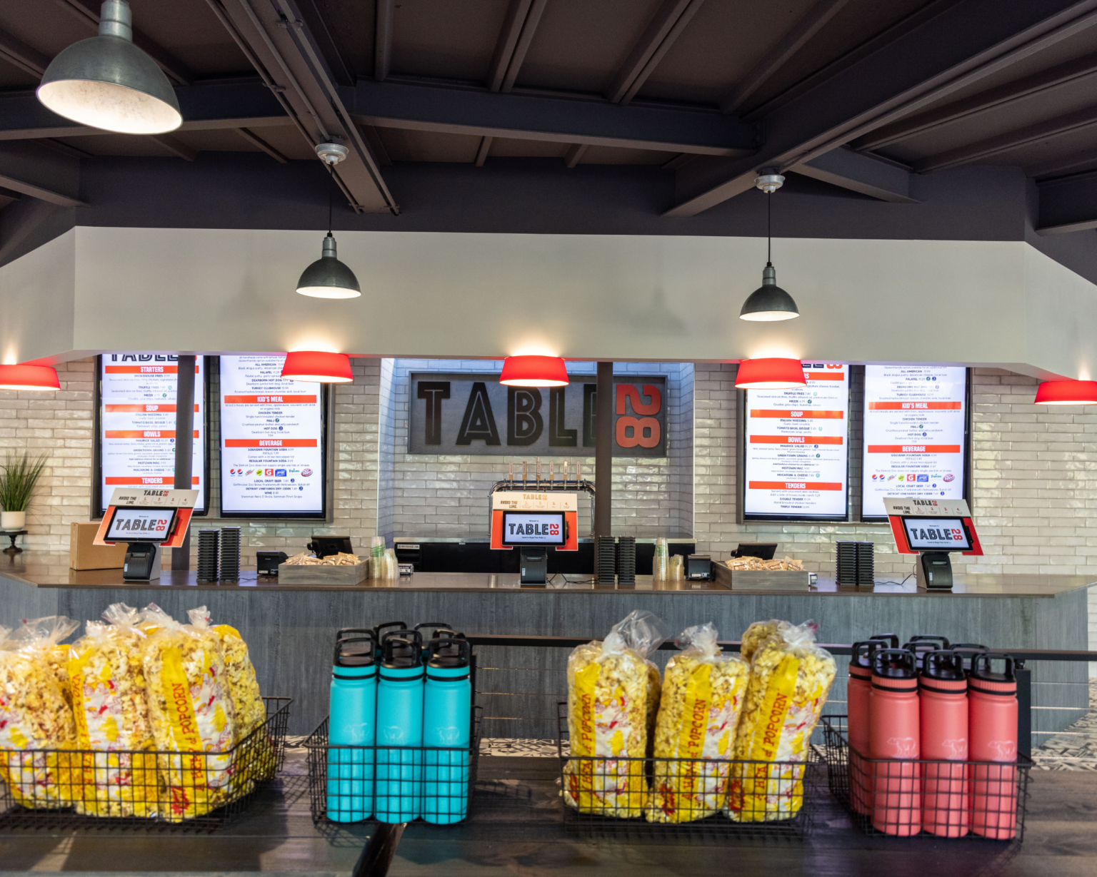 digital menu boards above a cafe counter
